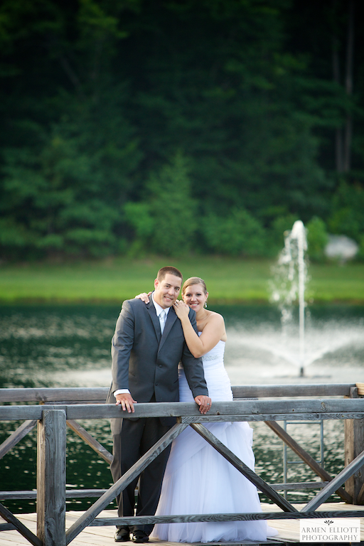 Bear Creek Resort Wedding photo of couple by water fountain by Armen Elliott